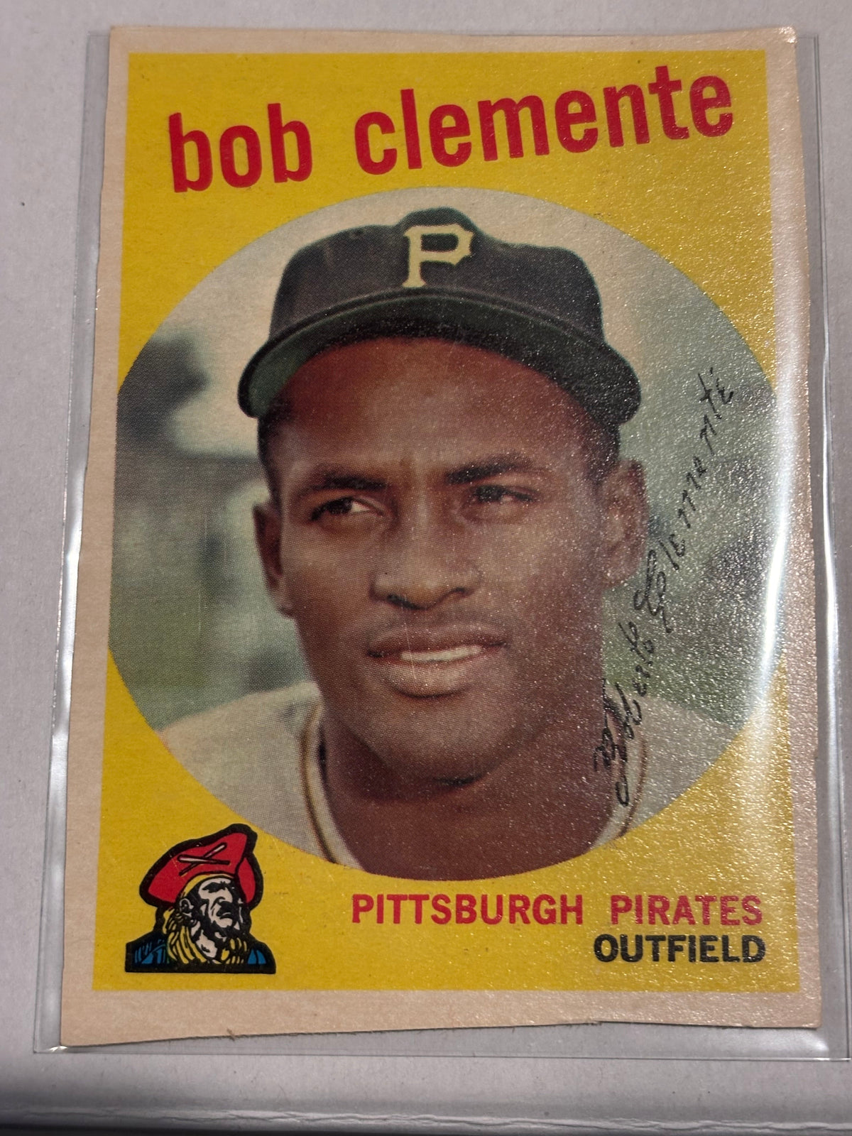 Front of Bob Clemente Pittsburgh Pirates baseball card with yellow design