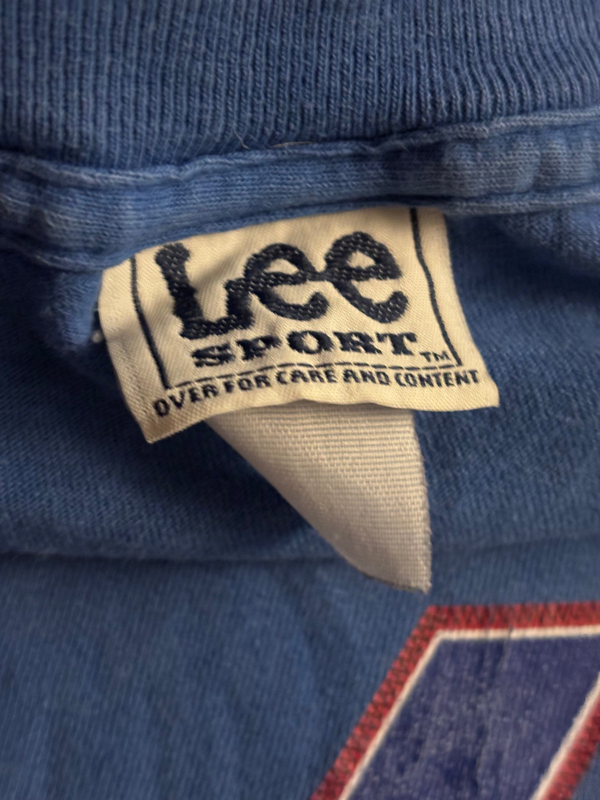 Close-up of the Chicago Cubs graphic on a dark navy Lee Sport T-shirt