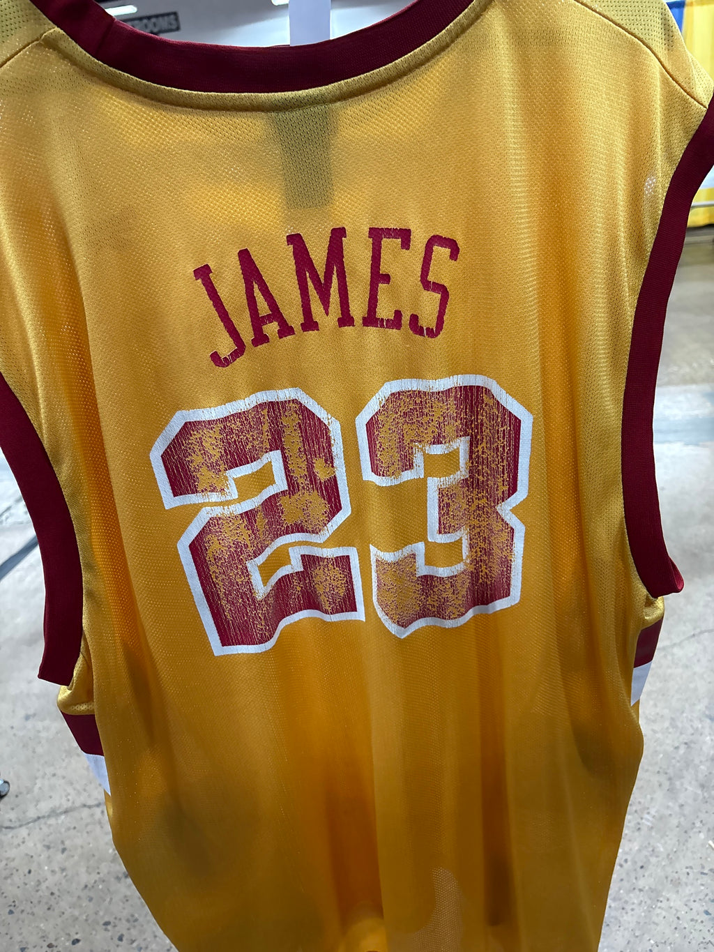 Back showing JAMES nameplate and heavily cracked number 23