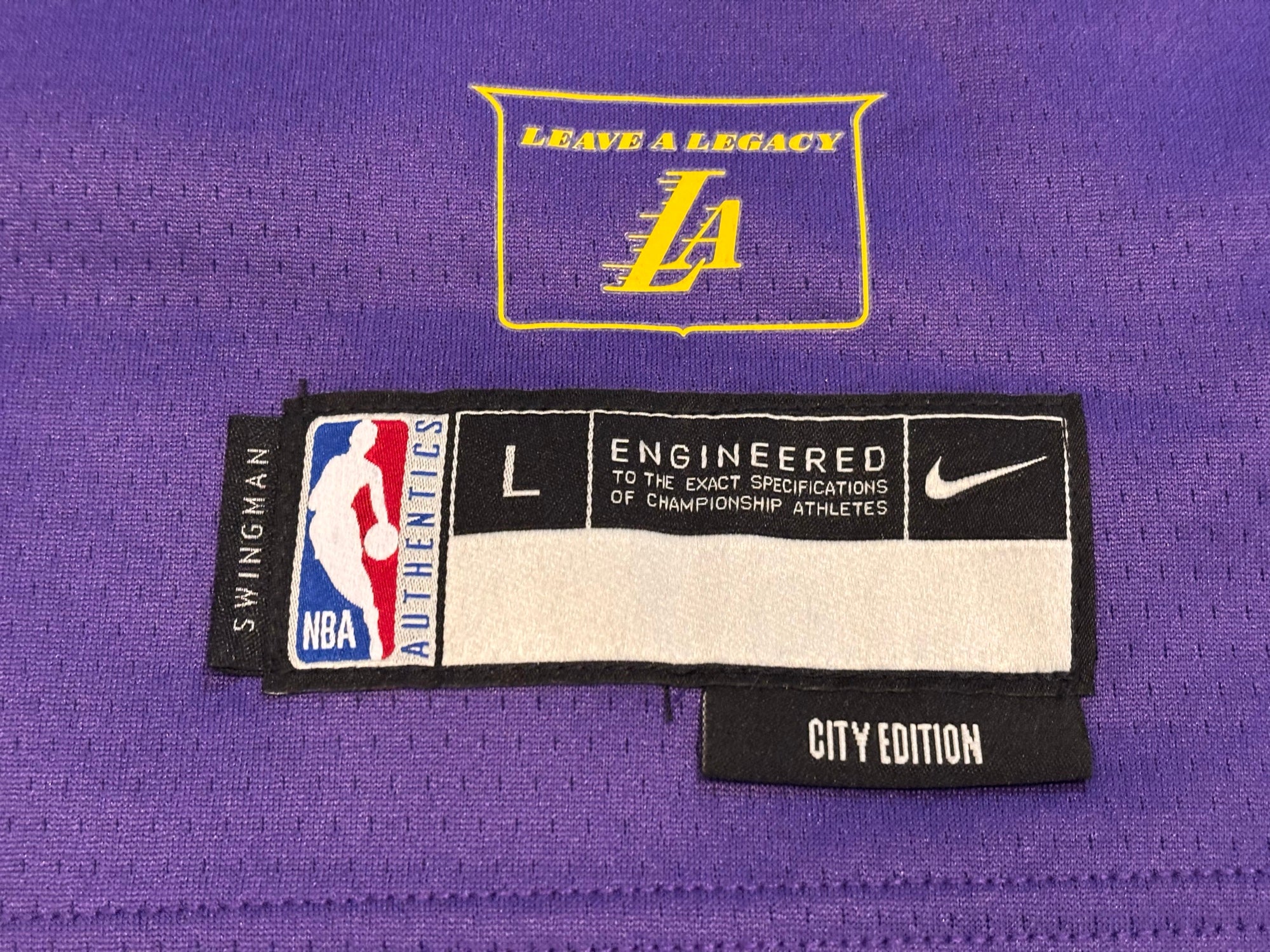 Leave A Legacy crest and Swingman NBA Authentics City Edition hem tag