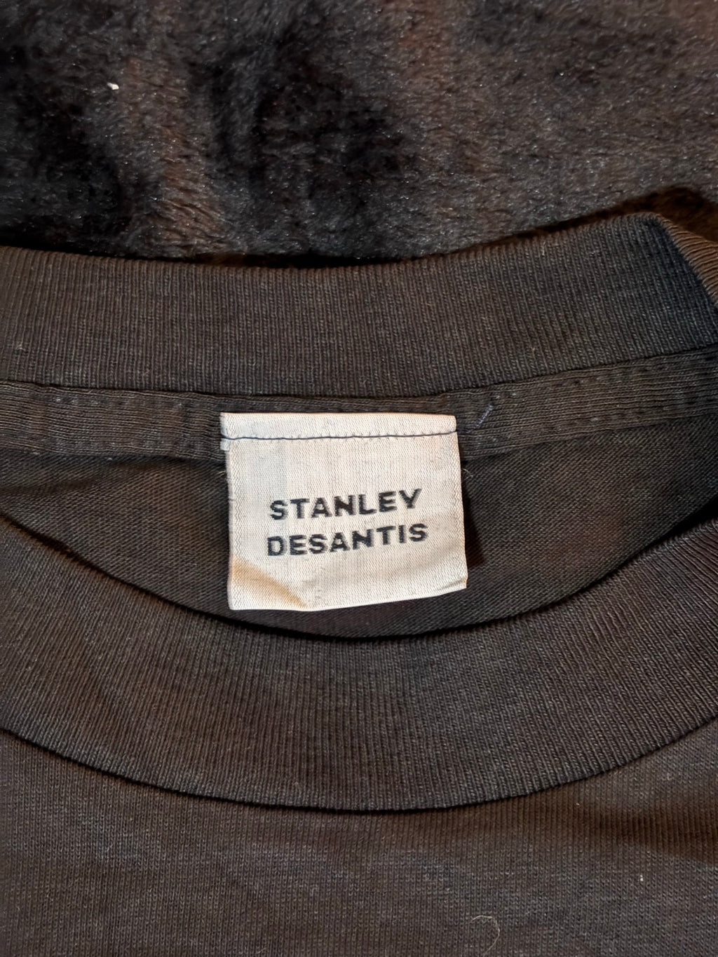 Stanley Desantis brand neck tag inside Voyager tee