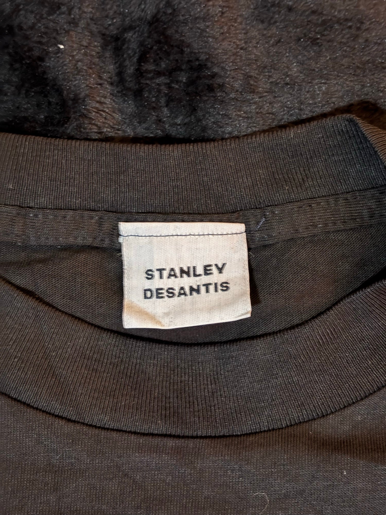 Stanley Desantis brand neck tag inside Voyager tee